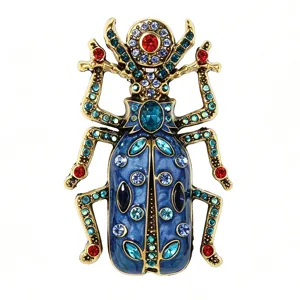 Vintage enamel beetle brooch featuring sparkling colorful rhinestones and gold tone alloy.