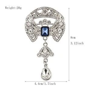 Elegante Vintage Strass Brosche mit blauem Kristall Anhänger, silberner Modeschmuck Stil.