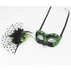 Detail view of the Halloween masquerade eye mask, green glitter, and mesh flower fascinator.