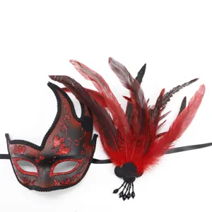 Halloween feather masquerade mask with glitter and red black details for party costume.