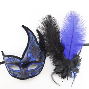 Masca de mascarada azul y negra con decoracion de plumas para fiestas y Halloween.