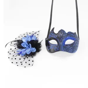 Detail view of blue glitter masquerade mask and matching mesh floral hair accessory
