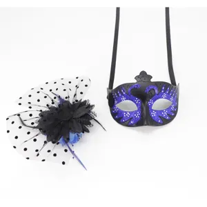 Detailed view of a black masquerade mask with swan pattern and mesh fascinator set