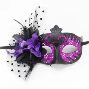 Close-up detail of black masquerade mask with elegant purple flower and polka dot mesh veil