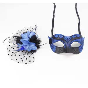 Blue and black masquerade mask with glitter details and matching polka dot mesh flower fascinator.