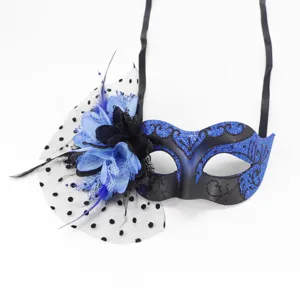 Elegant blue and black masquerade mask featuring a side flower and mesh veil decor.