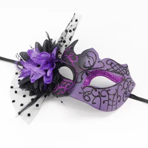 Detailed macro shot of a purple masquerade mask with a large flower and polka-dot mesh