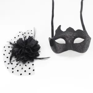 Close-up of black masquerade mask with crown design and matching mesh flower accessory