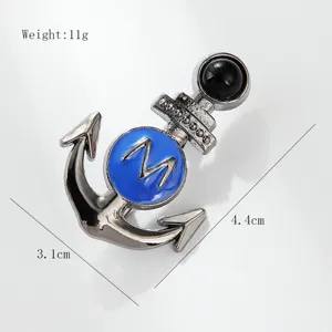 Close-up detail of anchor brooch with blue enamel and letter M, size 3.1x4.4cm specs.