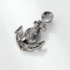 Detailed view of alloy anchor brooch back structure, showing pin clasp and metallic texture details.