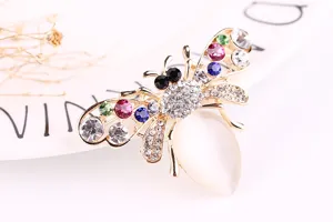 Exquisite bee brooch featuring colorful rhinestones and opal abdomen, elegant fashion accessory.