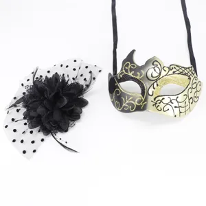 Elegant gold and black masquerade mask paired with a black mesh floral fascinator