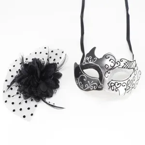 Set featuring a black feathered flower hair clip and a silver glitter masquerade mask