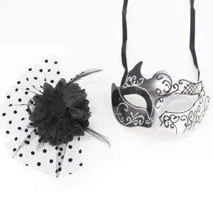 Elegant black and white masquerade mask paired with a polka dot mesh flower clip.