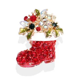 Exquisite Christmas boot crystal rhinestone brooch detail, sparkling holiday fashion accessory for women.