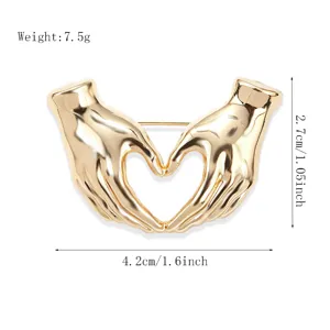 Golden hands heart brooch pin, chic creative alloy clothing accessory, 4.2cm width