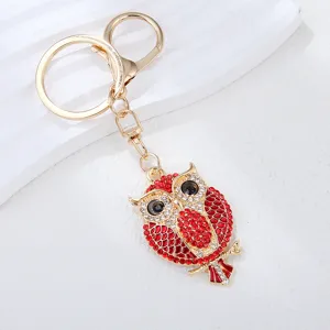 Detaillierte Eulen-Schlüsselanhänger, goldene Legierung Taschenanhänger für Damen.