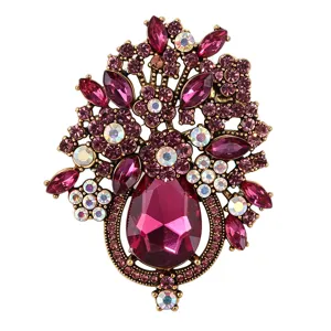 Exquisite crystal rhinestone flower basket brooch detail, vintage gold-tone metal alloy.