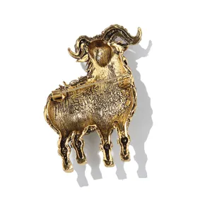 Vintage alloy ram brooch detail reverse side showing pin clasp and textured golden back finish