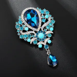 Spilla di lusso con goccia di cristallo blu, elegante gioiello vintage con strass.