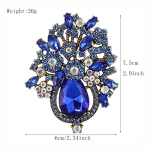 Elegant blue crystal flower basket brooch pin for women clothing, sparkly rhinestone fashion jewelry.