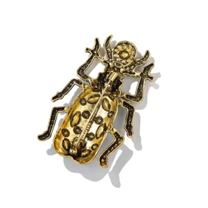 Detailed view of vintage alloy beetle brooch pin, artistic insect jewelry for men clothing.