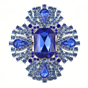 Detailed view of luxury royal blue crystal rhinestone brooch, sparkling vintage floral pin.