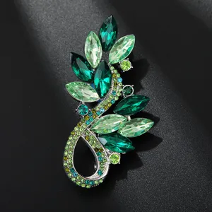 Luxury green rhinestone crystal brooch for women, elegant leaf pin suit dress accessory.