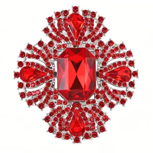 Detailed view of luxury red crystal rhinestone cross brooch, elegant vintage style jewelry.