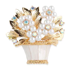 Detailed view of the gold-plated flower basket brooch with pearl blossoms and iridescent rhinestones.
