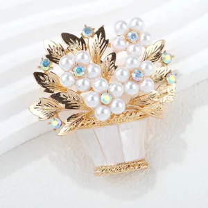 Elegant pearl flower basket brooch with sparkling rhinestones, detailed gold leaves accessory.