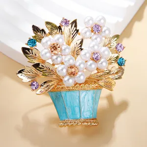 Pearl flower basket brooch detail, elegant gold tone metal rhinestone crystal fashion pin item.