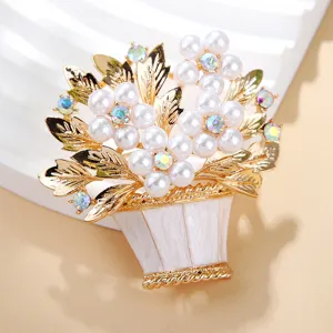 Close-up detail of the elegant pearl flower basket brooch, shining gold plating and rhinestones.