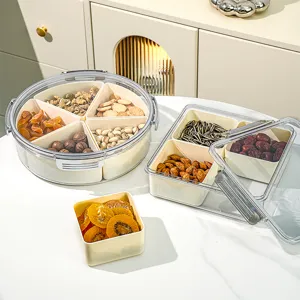 Modern multi-compartment clear lidded storage box set for snacks, candies, and dried fruit.