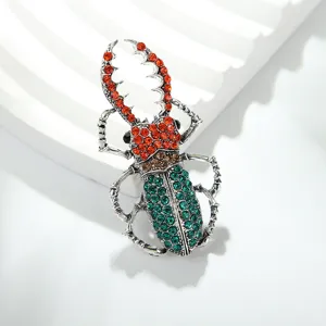 Vintage crystal beetle brooch pin, elegant silver tone rhinestone insect lapel pin jewelry.