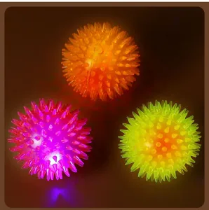 LED glowing spiky ball pet toy detail view showing colorful flashing spike ball design