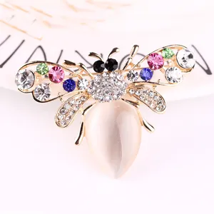 Elegant rhinestone cat eye bee brooch pin for women, stunning crystal insect lapel jewelry.