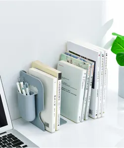 Detailed view of grey plastic desktop bookend with pen holder, organizing books neatly on white desk.