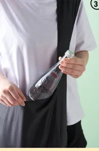 Detail view of the black nylon folding travel shopping bag pocket for convenient daily use.