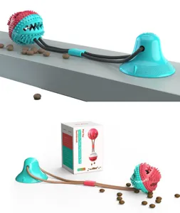 Detailed view of interactive pet suction cup dog toy with squeaky molar chew ball.