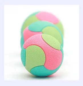 Detailed view of colorful textured pet chew ball, durable rubber dog bouncy toy for large dogs.