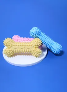 Jouet a macher pour chien en TPR en forme d os avec picots pour nettoyage des dents et jeu.