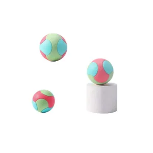 Durable multi-color pet toy bouncy ball with textured surface for dog teething and chewing training.
