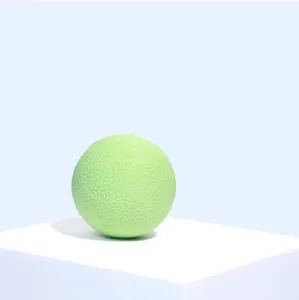 Detailed shot of the light green textured rubber pet bouncy toy ball, close up detail view.