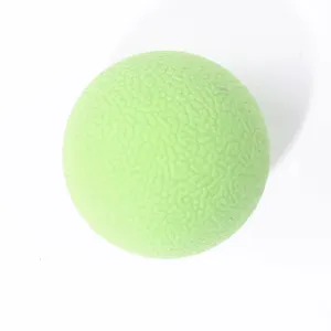 Green rubber dog bouncy ball toy, textured solid ball for pet play and daily training.