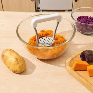 Manual potato masher kitchen tool for baby food, stainless steel pressing plate and handle.