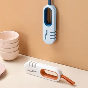 Multi-functional 4-in-1 kitchen knife sharpener tool with multi-stage grinding slots for home use.