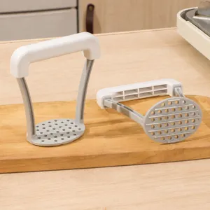 Manual potato masher for kitchen, ergonomic white and grey food masher tool for baby food prep.