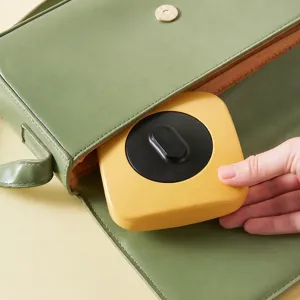 Portable rotating folding shopping bag storage box, compact plastic case for travel use.