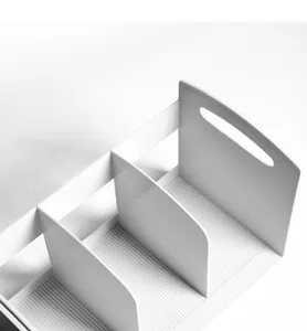 White plastic 3-grid desktop storage rack, compartment organizer with handle detail.